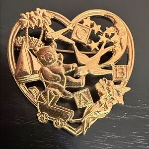vintage Avon "Sweet Memories" heart-shaped brooch featuring a gold-tone design
